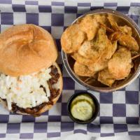 Brisket Sandwich - On Kaiser Roll · Shredded brisket with a touch of homemade tangy bbq sauce, topped with coleslaw.