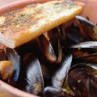 Bowl Of Mussels · Sweet mussels in either a garlic white wine broth or spicy marinara, served with garlic bread.