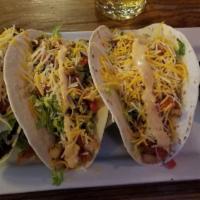 Tacos · Soft-shell tortillas with lettuce, Pico de Gallo, Cheddar, chipotle ranch dressing, and a si...