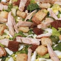 Chicken Caesar Salad · Grilled chicken breast on our mix of romaine and iceberg lettuce, with Parmesan cheese, chop...