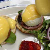 Egg Benedict · Two poached eggs with Canadian bacon with hollandaise sauce served on an English muffin.