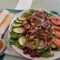 Grilled Chicken Salad · Marinated grilled chicken over a garden salad (Iceburg lettuce, tomatoes, cucumbers, black o...