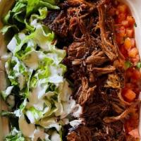Barbacoa Bowl · Shredded spicy beef includes: lettuce, rice, beans, pico de gallo, cheese and sour cream.