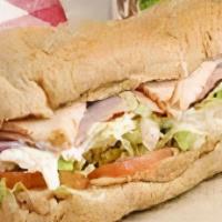 Jive Turkey · Golden Brown Turkey slices, cheddar cheese, lettuce & tomato on a large Sub roll