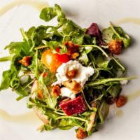 Arugula Salad · Arugula salad with beets, goat cheese, candied walnuts, red onion, and cherry tomatoes with ...