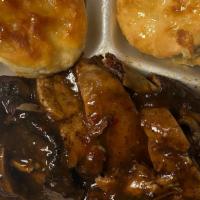 Jerk Chicken & Biscuits · Jerked leg quarter with buttered and honey-drizzled biscuits.  Served with a side of our sig...