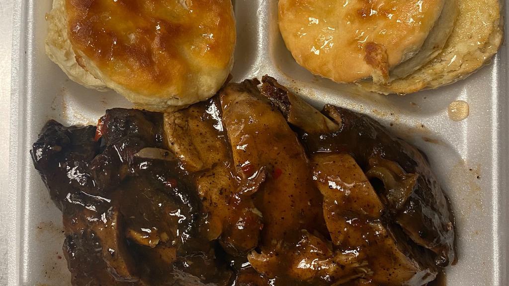 Jerk Chicken & Biscuits · Jerked leg quarter with buttered and honey-drizzled biscuits.  Served with a side of our signature jerk sauce.