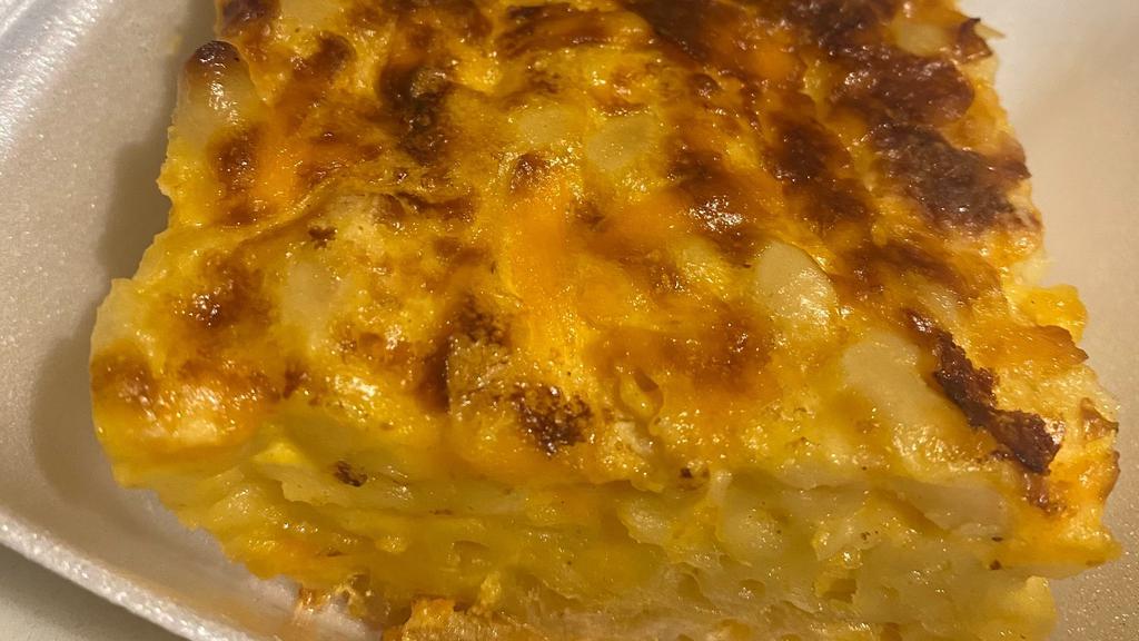Mac & Cheese · This is a melt in your mouth macaroni and cheese pie made with both cheddar and other cheeses.