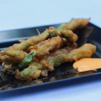 Crispy Green Beans · Deep fried lightly battered Fresh green beans served with spicy mayo dipping sauce.