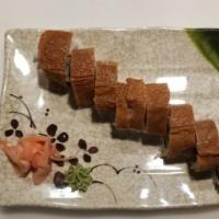 Inari Roll · Vegan. In: cucumber, avocado, yellow radish, burdock, out: sesame seed, sauce: sweet glaze.