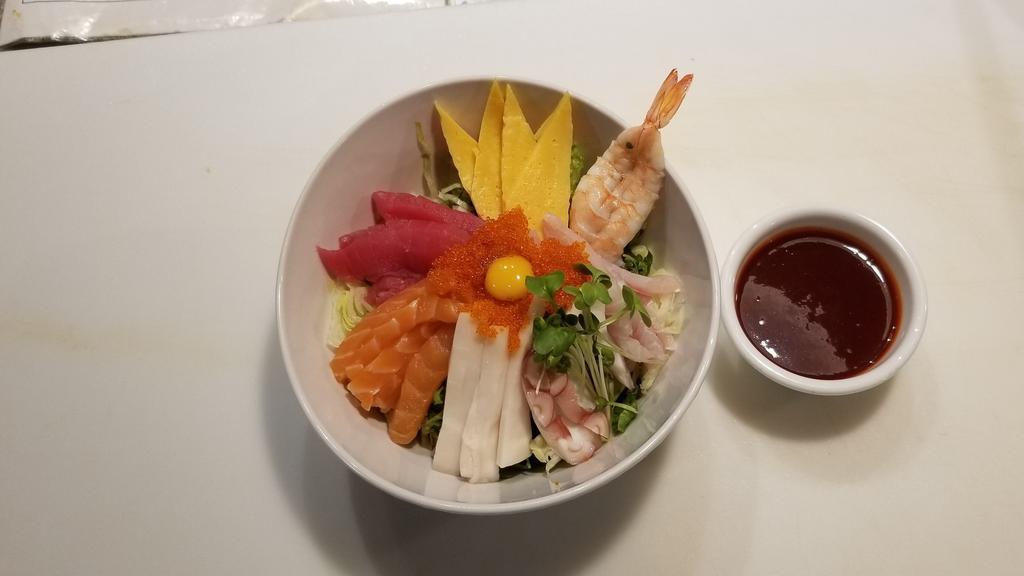Hwe Dup Bap · Mixed vegetables and raw fish served with steamed rice and specialty hot sauce.