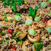 Arroz Chaufa · Peruvian-Cantonese style rice cooked in a wok and sautéed with our house sauce and your choi...