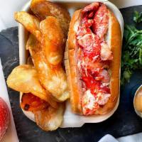 Classic Lobster Roll · New England style lobster roll served with golden chips. lobster can be dressed in light may...