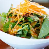 House Salad · Romaine lettuce, tomato, carrot, cabbage with peanut dressing or ginger dressing.