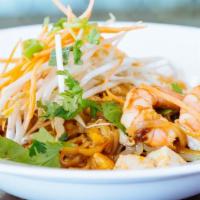 Pad Thai · Stir-fried rice noodles with bean sprout, scallion, egg, peanut in tamarind sauce.