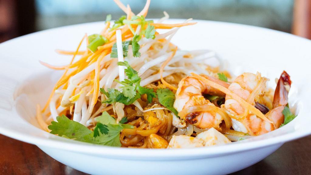 Pad Thai · Stir-fried rice noodles with bean sprout, scallion, egg, peanut in tamarind sauce.