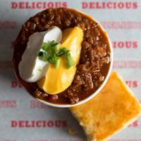 Uncle D'S Famous Chili · Topped with Cheddar sauce, green onions and sour cream, homemade cornbread.
