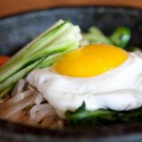 Bibimbap · NOT the stone pot heated bowl. Choice of grain topped with sautéed vegetables. Topped with s...