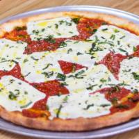 Margherita Pizza · Tomato Sauce, Imported Pomodorini, Sliced Fresh Mozzarella, Fresh Basil & Extra Virgin Olive...