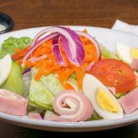 Chef Salad · Romaine, ham, American cheese, carrots, onions, tomatoes, cucumbers and mixed peppers.