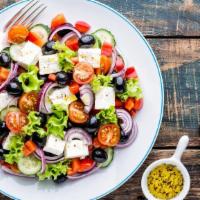 Greek Salad · Romaine, tomato, onion, olives, peppers, cucumber, feta and Greek dressing.