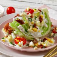 The Wedge Salad · Iceberg, tomato, bacon and blue cheese crumbles.