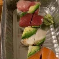 Rainbow Roll · California roll top with tuna, salmon, yellowtail, white fish, and avocado.
