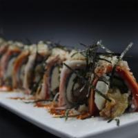 Amazing Spider Roll · Soft shell crab tempura, cucumber and cream cheese topped with crab stick, eel sauce and spi...