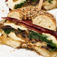 Egg White Sandwich · Your Choice of Bagel. Egg Whites, Swiss Cheese, Truffled Mushrooms, Baby Spinach, Turkey Bacon