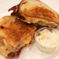 Reuben · grilled corned beef, sauerkraut, Swiss cheese and Russian dressing on grilled rye.
