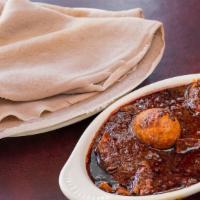 12 - Doro Wot · Traditional dishes chicken stew simmered in berbere red pepper sauce (spicy) or simmered in ...
