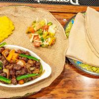 3 - Awaze Tibs  · Cubed tender beef or lamb marinated and cooked with tomato, jalapeno, garlic and berbere sauce