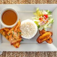 Pechuga A La Plancha · Grilled chicken served with rice, beans, fried sweet plantains &  salad.