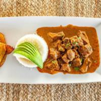 Seco De Carne · Beef stew served with rice, fried sweet plantains &  avocado