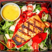 Basilico Salmon Salad · Grilled salmon, arugula, shaved parmesan, roasted red peppers, cherry tomatoes, lemon olive ...