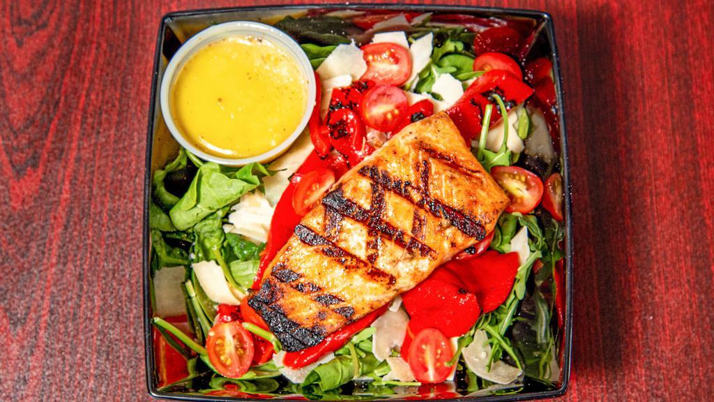 Basilico Salmon Salad · Grilled salmon, arugula, shaved parmesan, roasted red peppers, cherry tomatoes, lemon olive oil dressing.