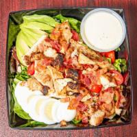 Cobb Salad · Grilled chicken, bacon, bleu cheese crumbles, hard-boiled egg, tomatoes, avocado, mixed gree...