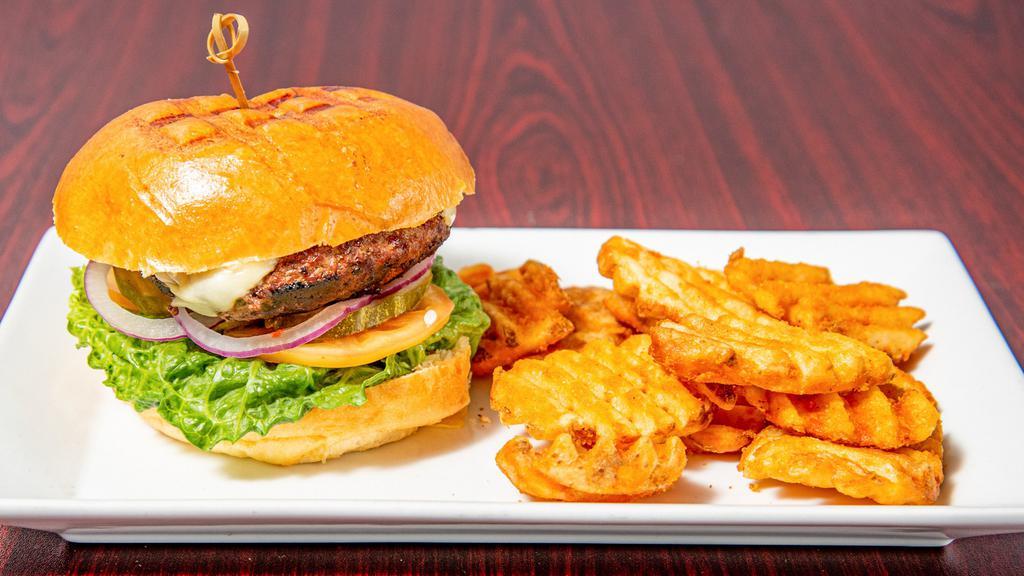 Classic American Burger · Served with lettuce, tomato, onion, pickles, American cheese.
