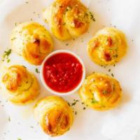 Garlic Knots
 · 6 Pieces. Served with tomato sauce.