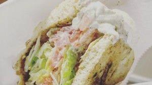 Grilled Chicken Sub · Grilled chicken, lettuce, mayo, tomatoes and fried onions on a wrap.