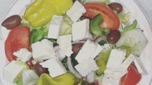 Greek Salad · Delicious salad with feta cheese, olives, pepperoncini, tomatoes, cucumber, red onion, green...