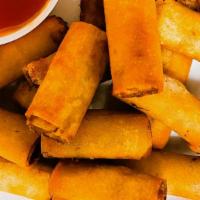 Lumpia Shanghai Rolls · Bite size Filipino egg rolls that are deep fried and made of ground pork and vegetables wrap...