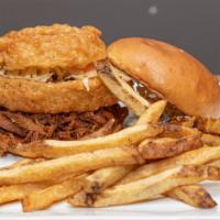 The Brisket · Pulled BBQ Brisket, Cole Slaw, Homemade Char Bar BBQ Sauce, Topped with an Onion Ring, Toast...