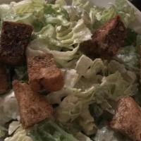 Caesar Salad · Romaine hearts with parmesan croutons and pecorino cheese.