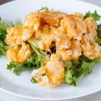 Rock Shrimp Tempura · Crispy rock shrimp with spicy creamy sauce.