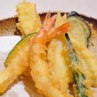 Tempura · Lightly battered and crispy fried shrimp with vegetables.