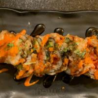 Godzilla Roll · Crispy roll with spicy salmon, spicy tuna, avocado and caviar on top.