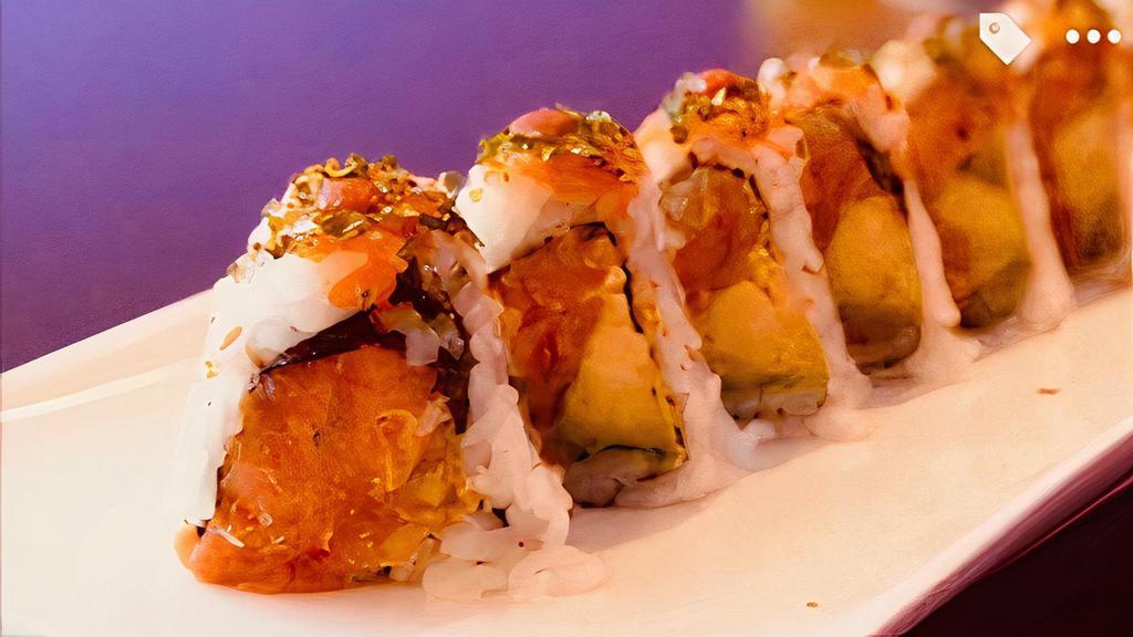 Volcano Roll · Spicy crunchy tuna roll with avocado and hot spicy sauce on top.
