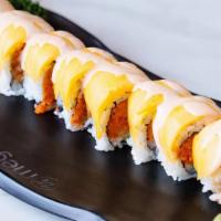 Summer Roll · Spicy tuna with cucumber inside, topped with mango and served with mango sauce.