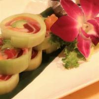 Naruto Roll · Tuna, salmon, yellowtail, crab stick, avocado and fish roe wrapped with cucumber. Served wit...